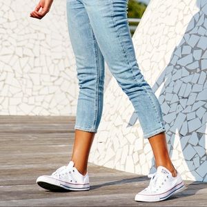 The retro, low-top women's white Converse Chuck Taylor All Star sneaker, size 10